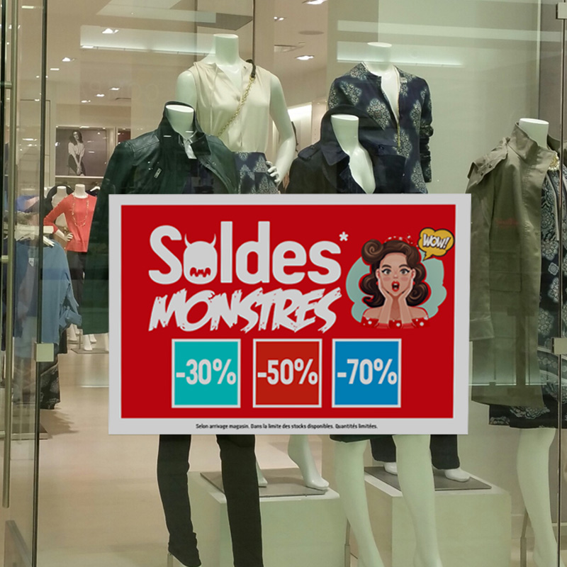 adhésif repositionnable collé sur une vitrine de magasin